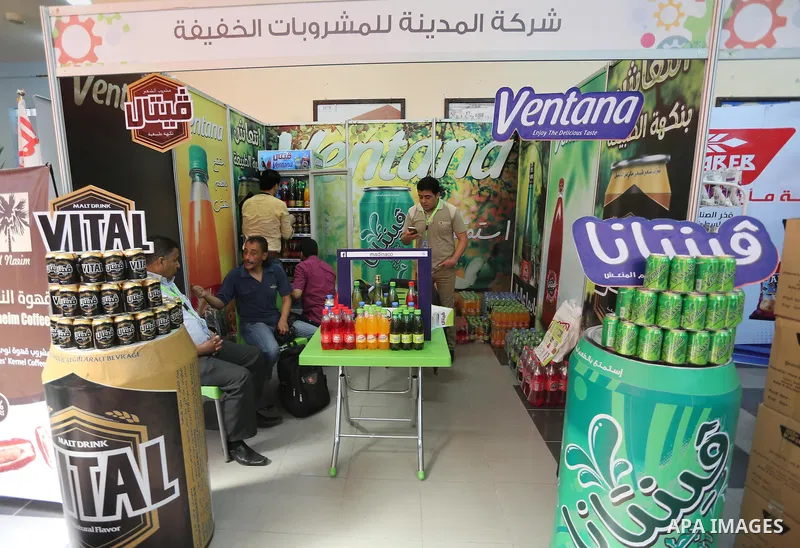 Palestinians attend exhibition for national products at Islamic University, in Gaza city, on April 24, 2016. Photo by Mohammed Asad