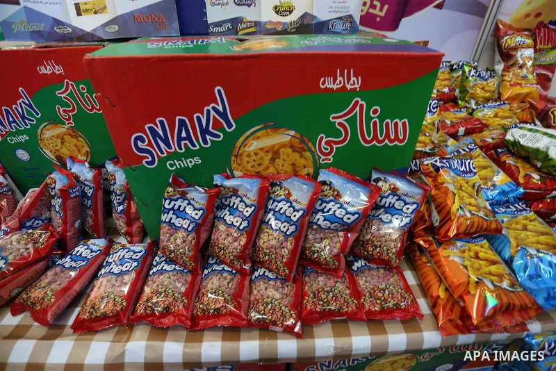 Palestinians attend exhibition for national products at Islamic University, in Gaza city, on April 24, 2016. Photo by Mohammed Asad