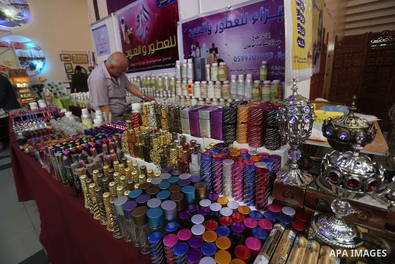 Palestinians attend exhibition for national products at Islamic University, in Gaza city, on April 24, 2016. Photo by Mohammed Asad