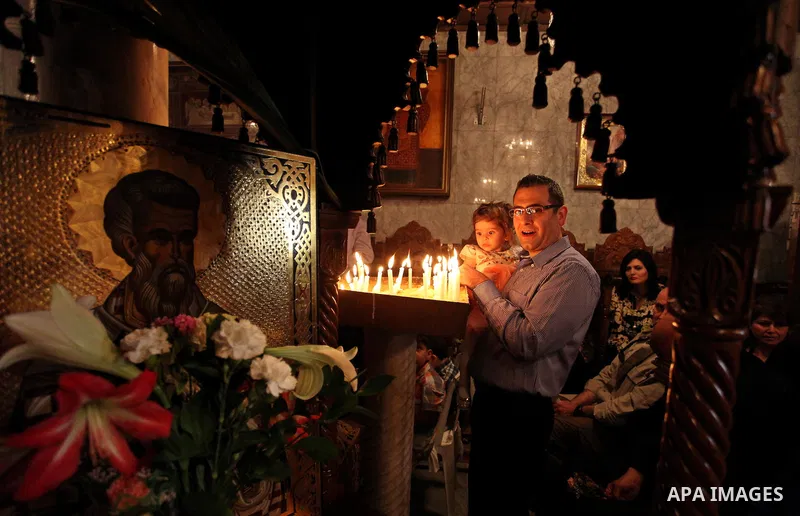 Palestinian Christians take part in the Greek Orthodox Christian Palm Sunday celebrations at St.Porphyrios Church in Gaza City, on April 24, 2016. Palm Sunday marks the triumphant return of Jesus Christ to Jerusalem when...