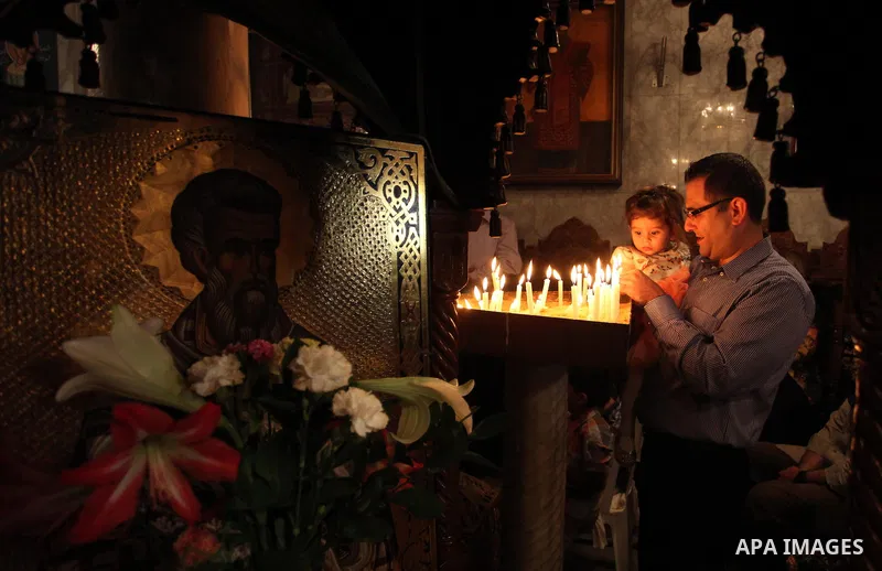 Palestinian Christians take part in the Greek Orthodox Christian Palm Sunday celebrations at St.Porphyrios Church in Gaza City, on April 24, 2016. Palm Sunday marks the triumphant return of Jesus Christ to Jerusalem when...