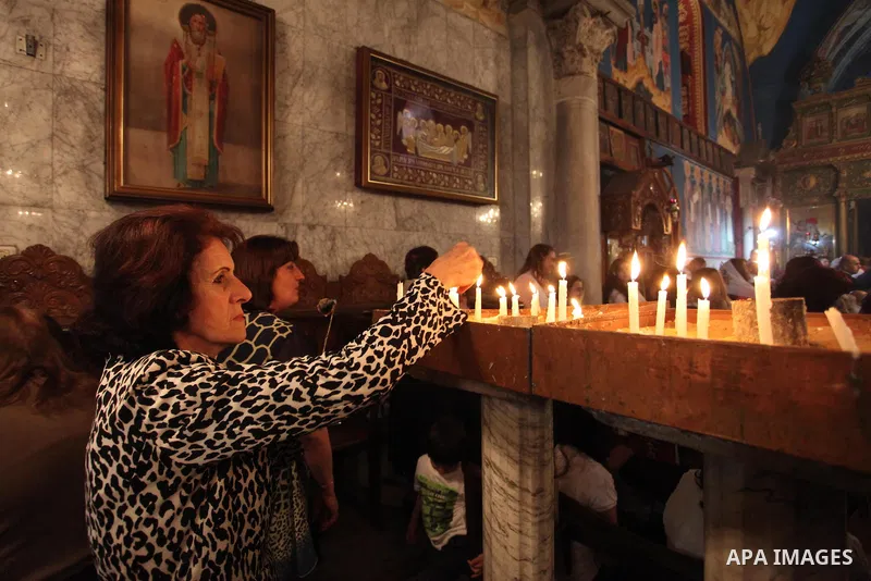 Palestinian Christians take part in the Greek Orthodox Christian Palm Sunday celebrations at St.Porphyrios Church in Gaza City, on April 24, 2016. Palm Sunday marks the triumphant return of Jesus Christ to Jerusalem when...