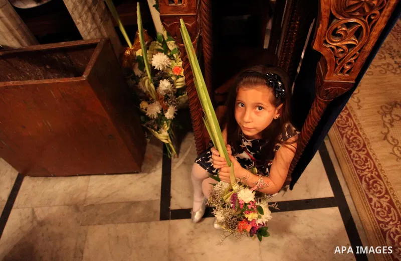 Palestinian Christians take part in the Greek Orthodox Christian Palm Sunday celebrations at St.Porphyrios Church in Gaza City, on April 24, 2016. Palm Sunday marks the triumphant return of Jesus Christ to Jerusalem when...
