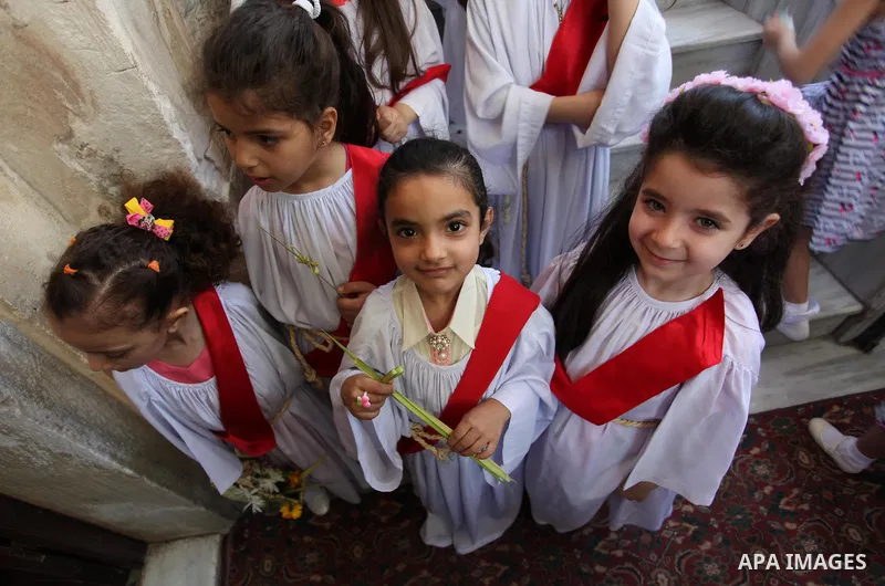 Palestinian Christians take part in the Greek Orthodox Christian Palm Sunday celebrations at St.Porphyrios Church in Gaza City, on April 24, 2016. Palm Sunday marks the triumphant return of Jesus Christ to Jerusalem when...