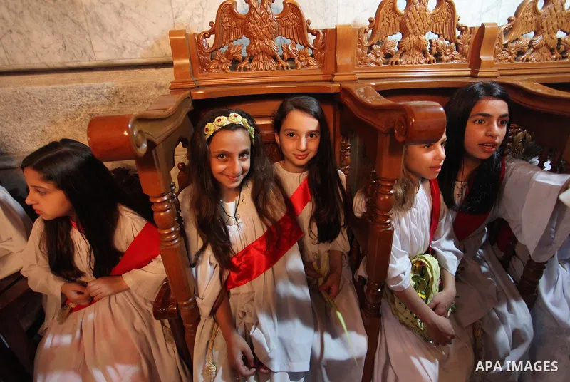 Palestinian Christians take part in the Greek Orthodox Christian Palm Sunday celebrations at St.Porphyrios Church in Gaza City, on April 24, 2016. Palm Sunday marks the triumphant return of Jesus Christ to Jerusalem when...