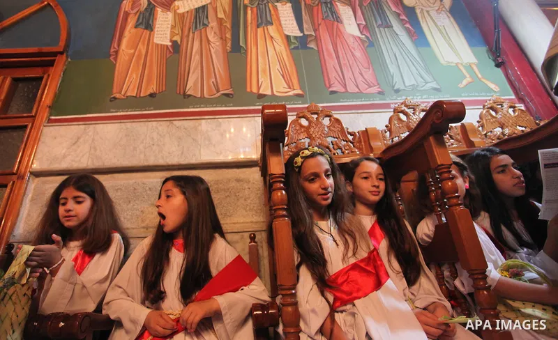 Palestinian Christians take part in the Greek Orthodox Christian Palm Sunday celebrations at St.Porphyrios Church in Gaza City, on April 24, 2016. Palm Sunday marks the triumphant return of Jesus Christ to Jerusalem when...