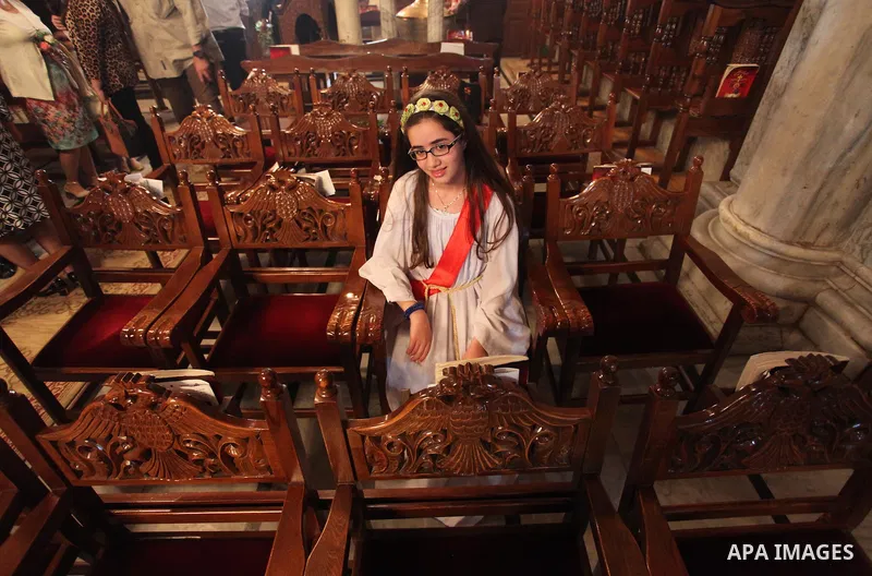 Palestinian Christians take part in the Greek Orthodox Christian Palm Sunday celebrations at St.Porphyrios Church in Gaza City, on April 24, 2016. Palm Sunday marks the triumphant return of Jesus Christ to Jerusalem when...