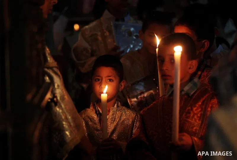 Palestinian Christians take part in the Greek Orthodox Christian Palm Sunday celebrations at St.Porphyrios Church in Gaza City, on April 24, 2016. Palm Sunday marks the triumphant return of Jesus Christ to Jerusalem when...