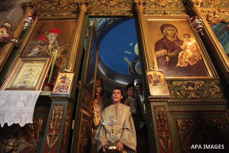 Palestinian Christians take part in the Greek Orthodox Christian Palm Sunday celebrations at St.Porphyrios Church in Gaza City, on April 24, 2016. Palm Sunday marks the triumphant return of Jesus Christ to Jerusalem when...