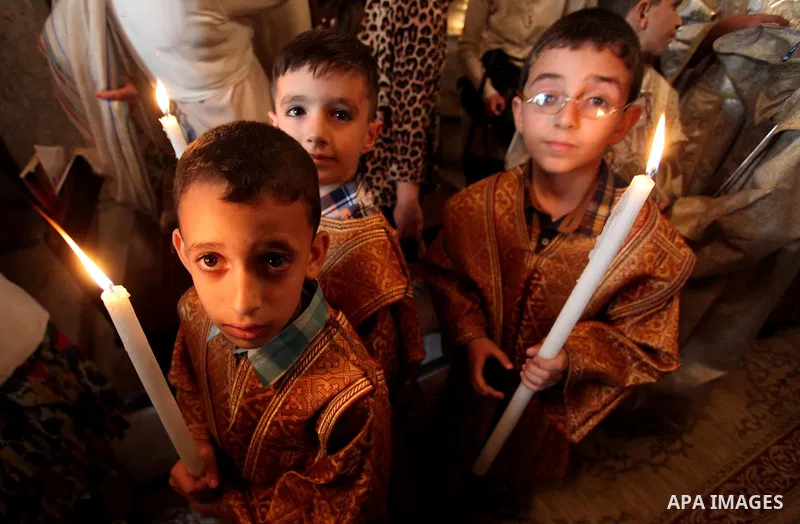 Palestinian Christians take part in the Greek Orthodox Christian Palm Sunday celebrations at St.Porphyrios Church in Gaza City, on April 24, 2016. Palm Sunday marks the triumphant return of Jesus Christ to Jerusalem when...