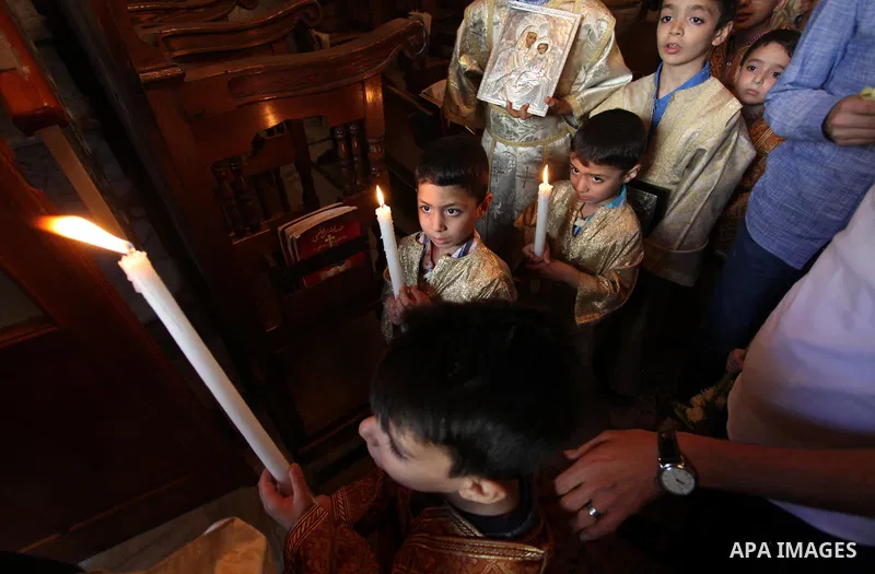 Palestinian Christians take part in the Greek Orthodox Christian Palm Sunday celebrations at St.Porphyrios Church in Gaza City, on April 24, 2016. Palm Sunday marks the triumphant return of Jesus Christ to Jerusalem when...
