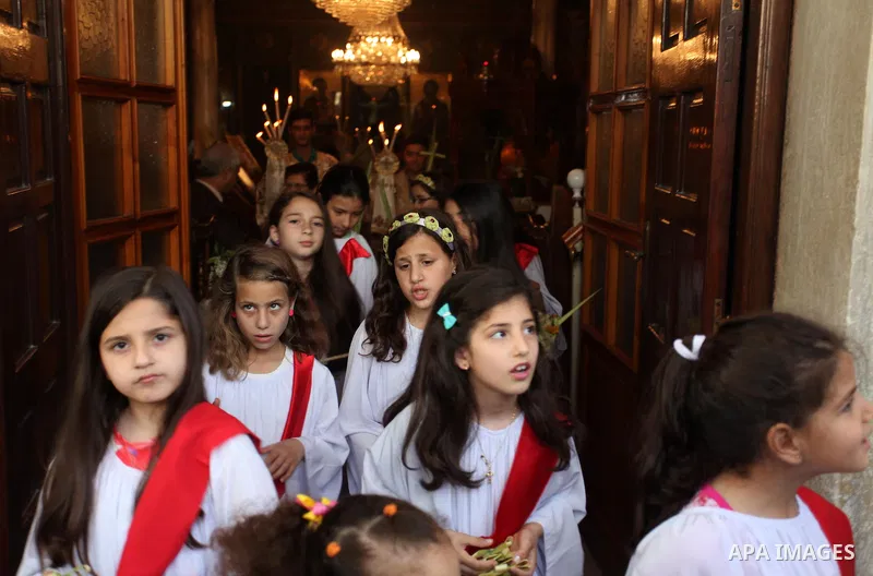 Palestinian Christians take part in the Greek Orthodox Christian Palm Sunday celebrations at St.Porphyrios Church in Gaza City, on April 24, 2016. Palm Sunday marks the triumphant return of Jesus Christ to Jerusalem when...