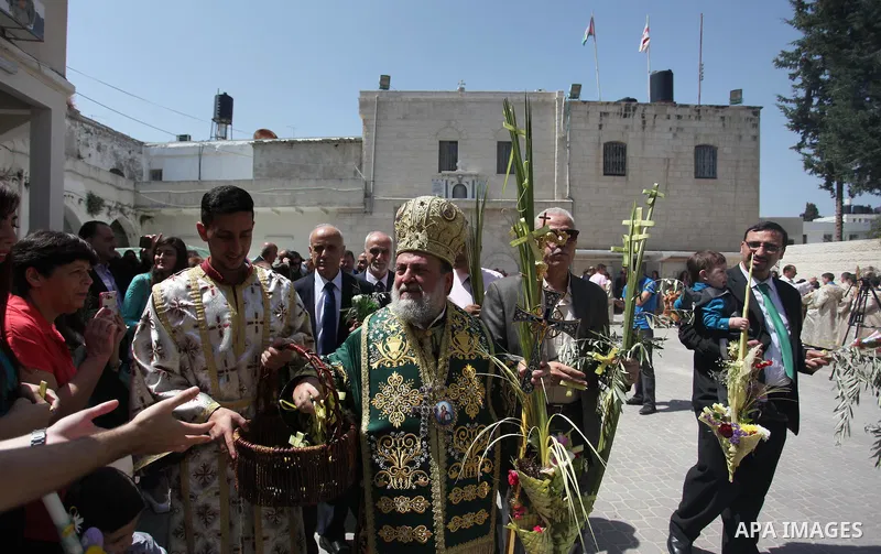 Palestinian Christians take part in the Greek Orthodox Christian Palm Sunday celebrations at St.Porphyrios Church in Gaza City, on April 24, 2016. Palm Sunday marks the triumphant return of Jesus Christ to Jerusalem when...