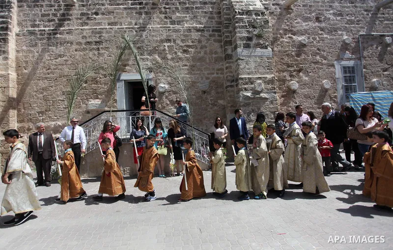 Palestinian Christians take part in the Greek Orthodox Christian Palm Sunday celebrations at St.Porphyrios Church in Gaza City, on April 24, 2016. Palm Sunday marks the triumphant return of Jesus Christ to Jerusalem when...