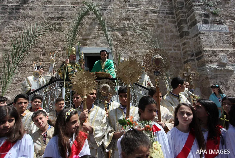 Palestinian Christians take part in the Greek Orthodox Christian Palm Sunday celebrations at St.Porphyrios Church in Gaza City, on April 24, 2016. Palm Sunday marks the triumphant return of Jesus Christ to Jerusalem when...
