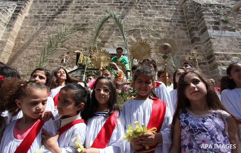 Palestinian Christians take part in the Greek Orthodox Christian Palm Sunday celebrations at St.Porphyrios Church in Gaza City, on April 24, 2016. Palm Sunday marks the triumphant return of Jesus Christ to Jerusalem when...