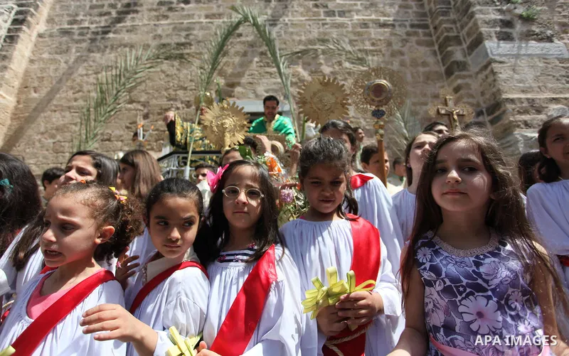 Palestinian Christians take part in the Greek Orthodox Christian Palm Sunday celebrations at St.Porphyrios Church in Gaza City, on April 24, 2016. Palm Sunday marks the triumphant return of Jesus Christ to Jerusalem when...