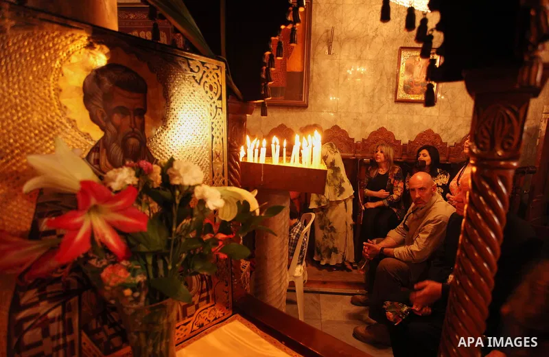 Palestinian Christians take part in the Greek Orthodox Christian Palm Sunday celebrations at St.Porphyrios Church in Gaza City, on April 24, 2016. Palm Sunday marks the triumphant return of Jesus Christ to Jerusalem when...