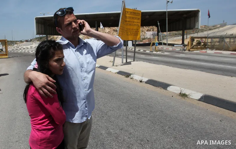 Released Palestinian prisoner Deema Al-Wawi, 12, who was detained by Israeli authorities for around two and half months, arrives with her brother following her release near the West Bank city of Tulkarm April 24, 2016. P...