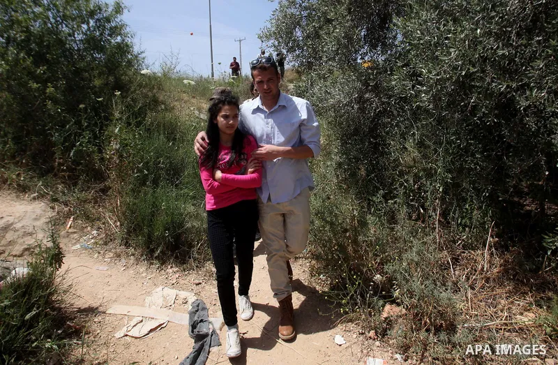 Released Palestinian prisoner Deema Al-Wawi, 12, who was detained by Israeli authorities for around two and half months, arrives with her brother following her release near the West Bank city of Tulkarm April 24, 2016. P...