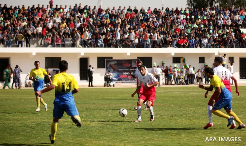 Palestinian Shabab Jabalia players and Shabab Khan Younis players compete during the final match of the Gaza Cup at Yarmuk stadium in Gaza City, on April 24, 2016. Photo by Ashraf Amra