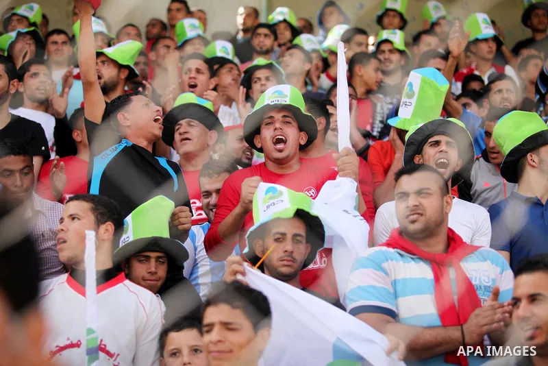 Fans attend the final match of the Gaza Cup between Shabab Jabalia and Shabab Khan Younis, at Yarmuk stadium in Gaza City, on April 24, 2016. Photo by Ashraf Amra