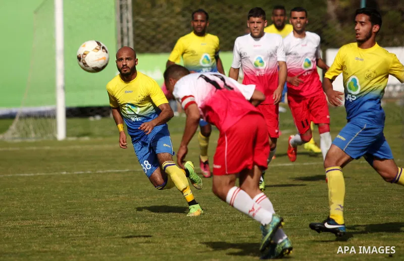 Palestinian Shabab Jabalia players and Shabab Khan Younis players compete during the final match of the Gaza Cup at Yarmuk stadium in Gaza City, on April 24, 2016. Photo by Ashraf Amra