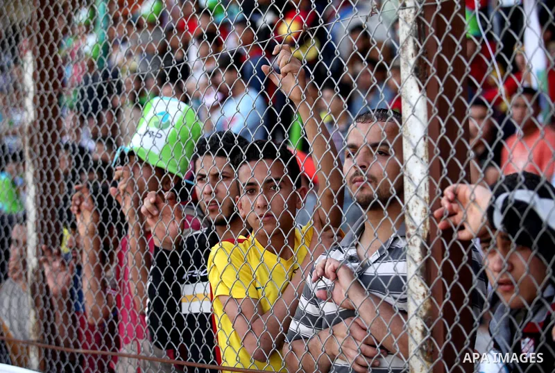 Fans attend the final match of the Gaza Cup between Shabab Jabalia and Shabab Khan Younis, at Yarmuk stadium in Gaza City, on April 24, 2016. Photo by Ashraf Amra