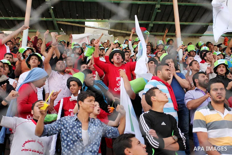 Fans attend the final match of the Gaza Cup between Shabab Jabalia and Shabab Khan Younis, at Yarmuk stadium in Gaza City, on April 24, 2016. Photo by Ashraf Amra