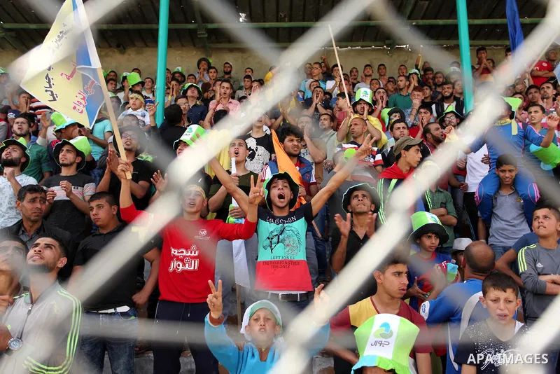 Fans attend the final match of the Gaza Cup between Shabab Jabalia and Shabab Khan Younis, at Yarmuk stadium in Gaza City, on April 24, 2016. Photo by Ashraf Amra