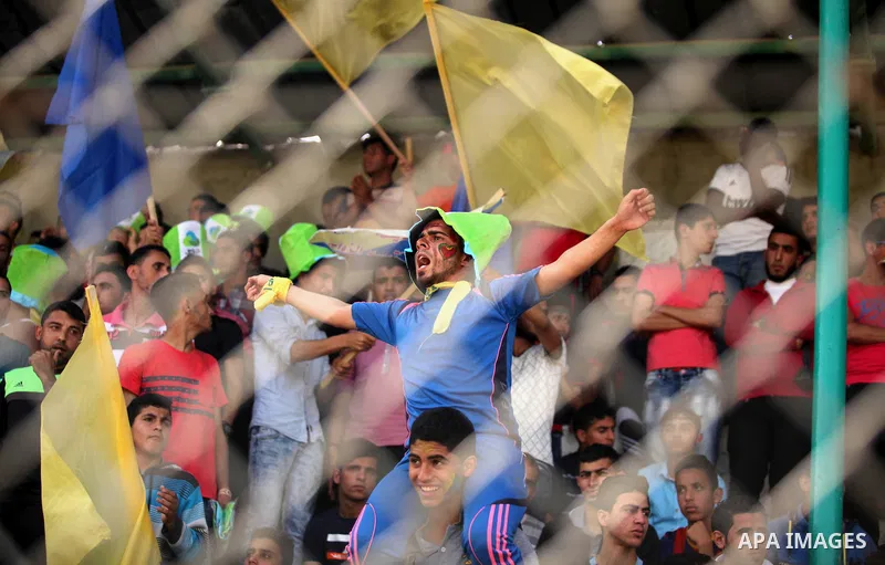 Fans attend the final match of the Gaza Cup between Shabab Jabalia and Shabab Khan Younis, at Yarmuk stadium in Gaza City, on April 24, 2016. Photo by Ashraf Amra