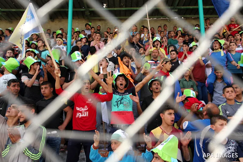 Fans attend the final match of the Gaza Cup between Shabab Jabalia and Shabab Khan Younis, at Yarmuk stadium in Gaza City, on April 24, 2016. Photo by Ashraf Amra