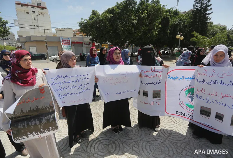Disabled Palestinians take part in a protest to demand their rights to work, in Gaza city, on April 25, 2016. Photo by Mohammed Asad