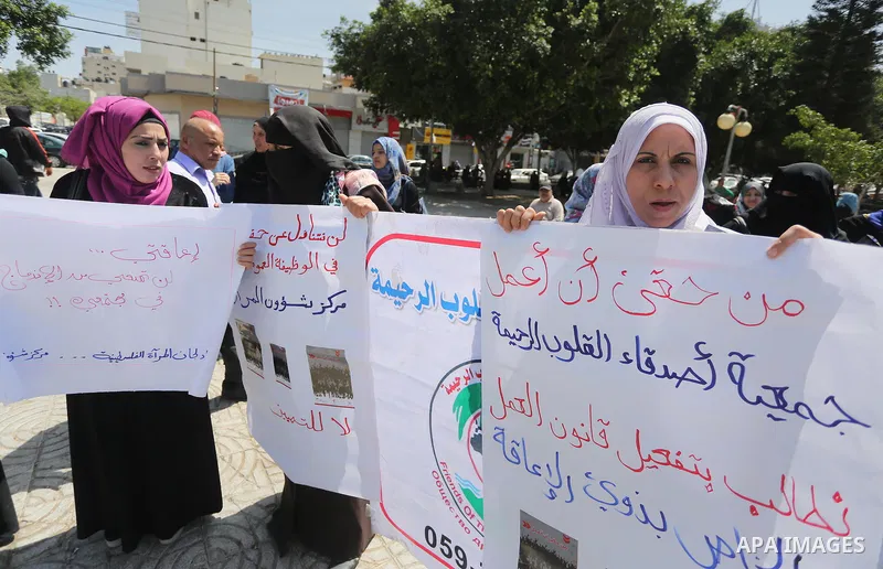 Disabled Palestinians take part in a protest to demand their rights to work, in Gaza city, on April 25, 2016. Photo by Mohammed Asad