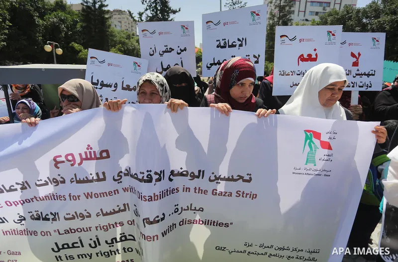 Disabled Palestinians take part in a protest to demand their rights to work, in Gaza city, on April 25, 2016. Photo by Mohammed Asad