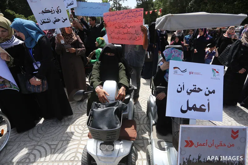 Disabled Palestinians take part in a protest to demand their rights to work, in Gaza city, on April 25, 2016. Photo by Mohammed Asad