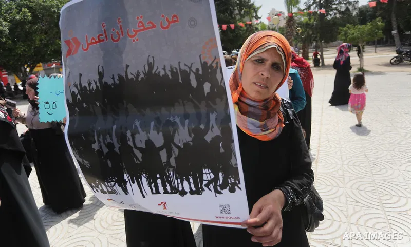 Disabled Palestinians take part in a protest to demand their rights to work, in Gaza city, on April 25, 2016. Photo by Mohammed Asad