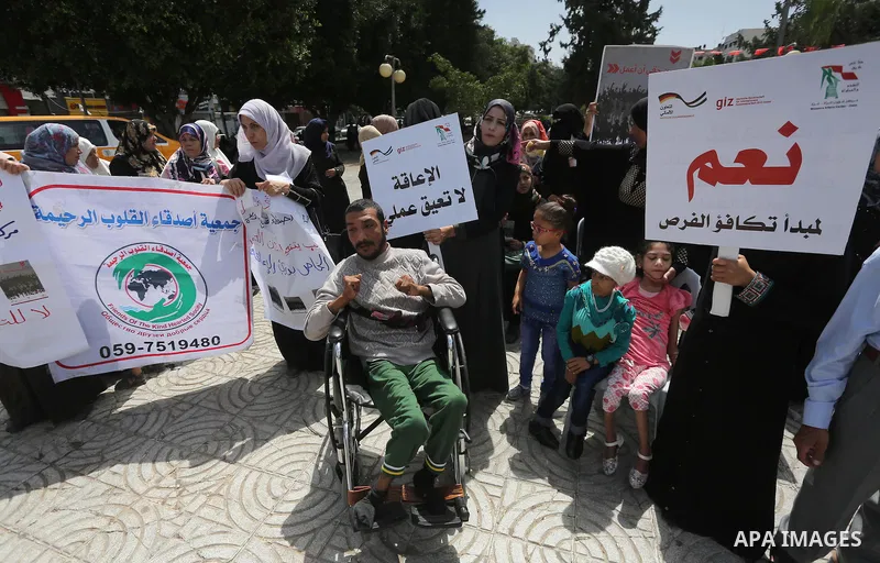 Disabled Palestinians take part in a protest to demand their rights to work, in Gaza city, on April 25, 2016. Photo by Mohammed Asad