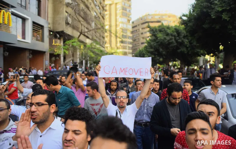Egyptian protesters chant slogans during a demonstration in Cairo on April 25, 2016, against the handing over of two Red Sea islands to Saudi Arabia. Egyptian police fired tear gas at protesters in the Egyptian capital w...