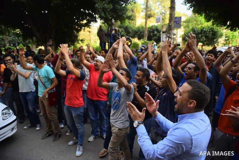 Egyptian protesters chant slogans during a demonstration in Cairo on April 25, 2016, against the handing over of two Red Sea islands to Saudi Arabia. Egyptian police fired tear gas at protesters in the Egyptian capital w...