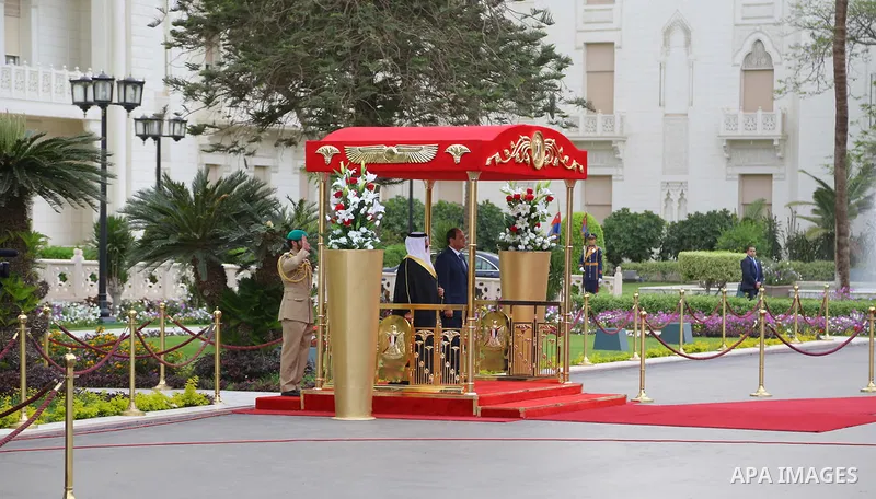 A handout picture released by the Egyptian Presidency on April 26, 2016 shows Egyptian President Abdel Fattah al-Sisi and Bahrain's King Hamad bin Issa al-Khalifa reviewing the honor guard during a welcoming ceremony in...