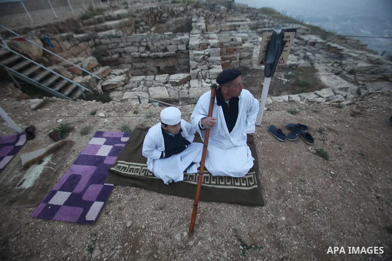 Members of the Samaritan sect take part in a traditional pilgrimage marking the holiday of Passover atop Mount Gerizim near the West Bank city of Nablus, on April 27, 2015. Photo by Nedal Eshtayah