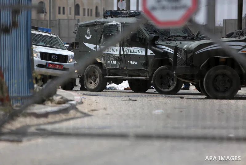 Israeli security forces stand guard at the Qalandia checkpoint, between Jerusalem and Ramallah in the Israeli occupied West Bank, after two Palestinians were shot as they approached security at the border carrying a knif...