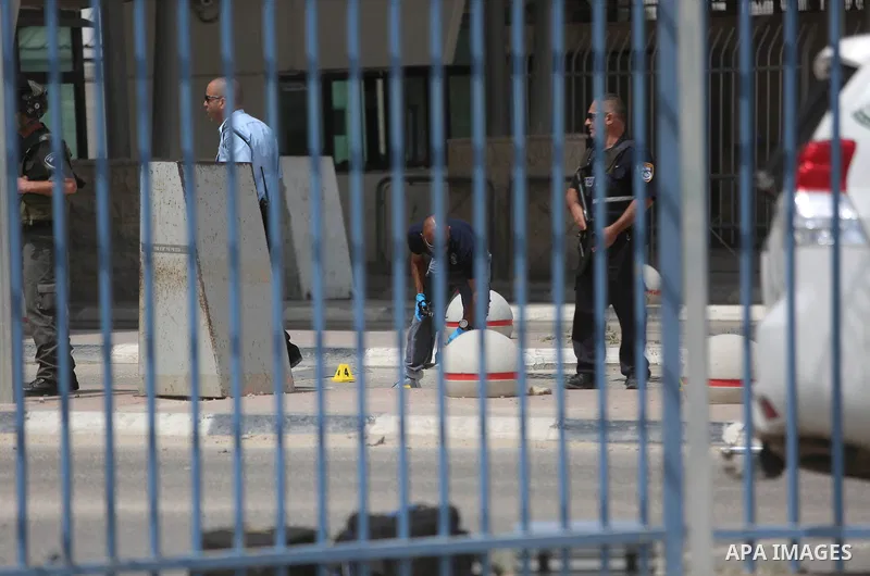 Israeli security forces stand guard at the Qalandia checkpoint, between Jerusalem and Ramallah in the Israeli occupied West Bank, after two Palestinians were shot as they approached security at the border carrying a knif...