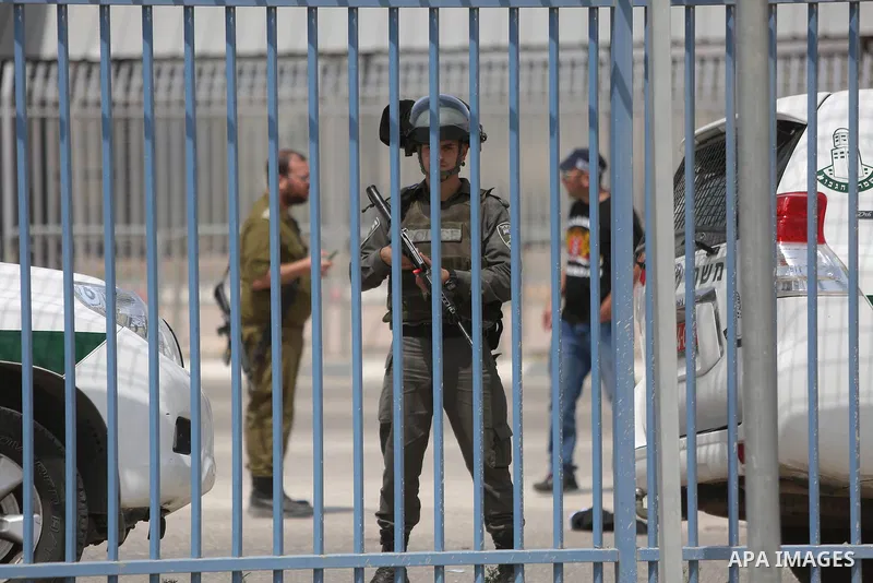 Israeli security forces stand guard at the Qalandia checkpoint, between Jerusalem and Ramallah in the Israeli occupied West Bank, after two Palestinians were shot as they approached security at the border carrying a knif...