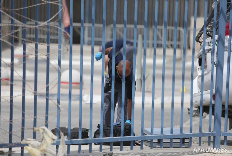Israeli security forces stand guard at the Qalandia checkpoint, between Jerusalem and Ramallah in the Israeli occupied West Bank, after two Palestinians were shot as they approached security at the border carrying a knif...