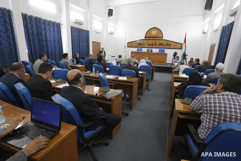 Members of the Palestinian legislative council from Hamas movement attend a meeting at the legislative council in Gaza city on, on April 27, 2016. Photo by Mohammed Asad