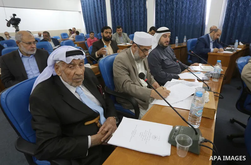 Members of the Palestinian legislative council from Hamas movement attend a meeting at the legislative council in Gaza city on, on April 27, 2016. Photo by Mohammed Asad