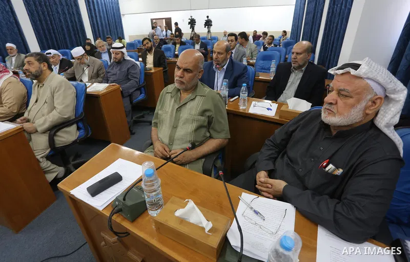 Members of the Palestinian legislative council from Hamas movement attend a meeting at the legislative council in Gaza city on, on April 27, 2016. Photo by Mohammed Asad