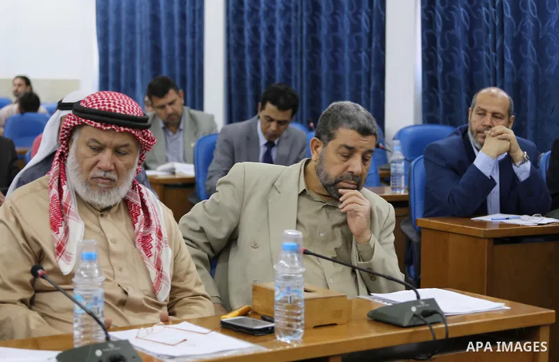 Members of the Palestinian legislative council from Hamas movement attend a meeting at the legislative council in Gaza city on, on April 27, 2016. Photo by Mohammed Asad
